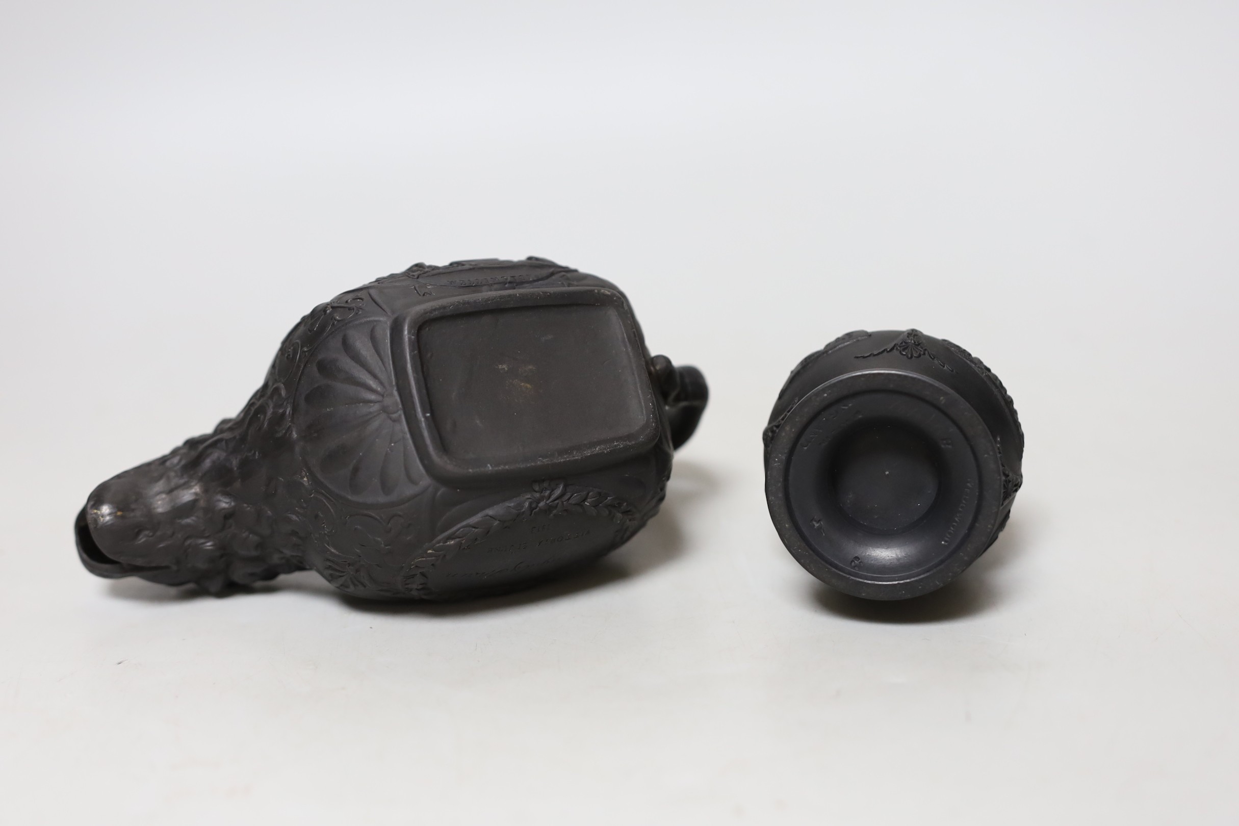 An early 19th century Wellington commemorative black basalt cream jug and a Wedgwood basalt vase